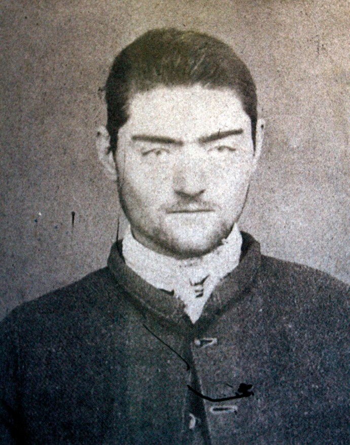 A photograph of a police mugshot of Ned Kelly, aged 16, at the Old Melbourne Gaol, March 13, 2008. Kelly, immortalised for using home-made armour in a final shoot-out with police, became a folk hero of Australia's colonial past with his gang's daring bank robberies and escapes. Kelly was hanged at the Melbourne Gaol in 1880. Australian archaeologists believe they have found the grave of Kelly on the site of an abandoned prison. REUTERS/Old Melbourne Gaol/Handout (AUSTRALIA). FOR EDITORIAL USE ONLY. NOT FOR SALE FOR MARKETING OR ADVERTISING CAMPAIGNS..
